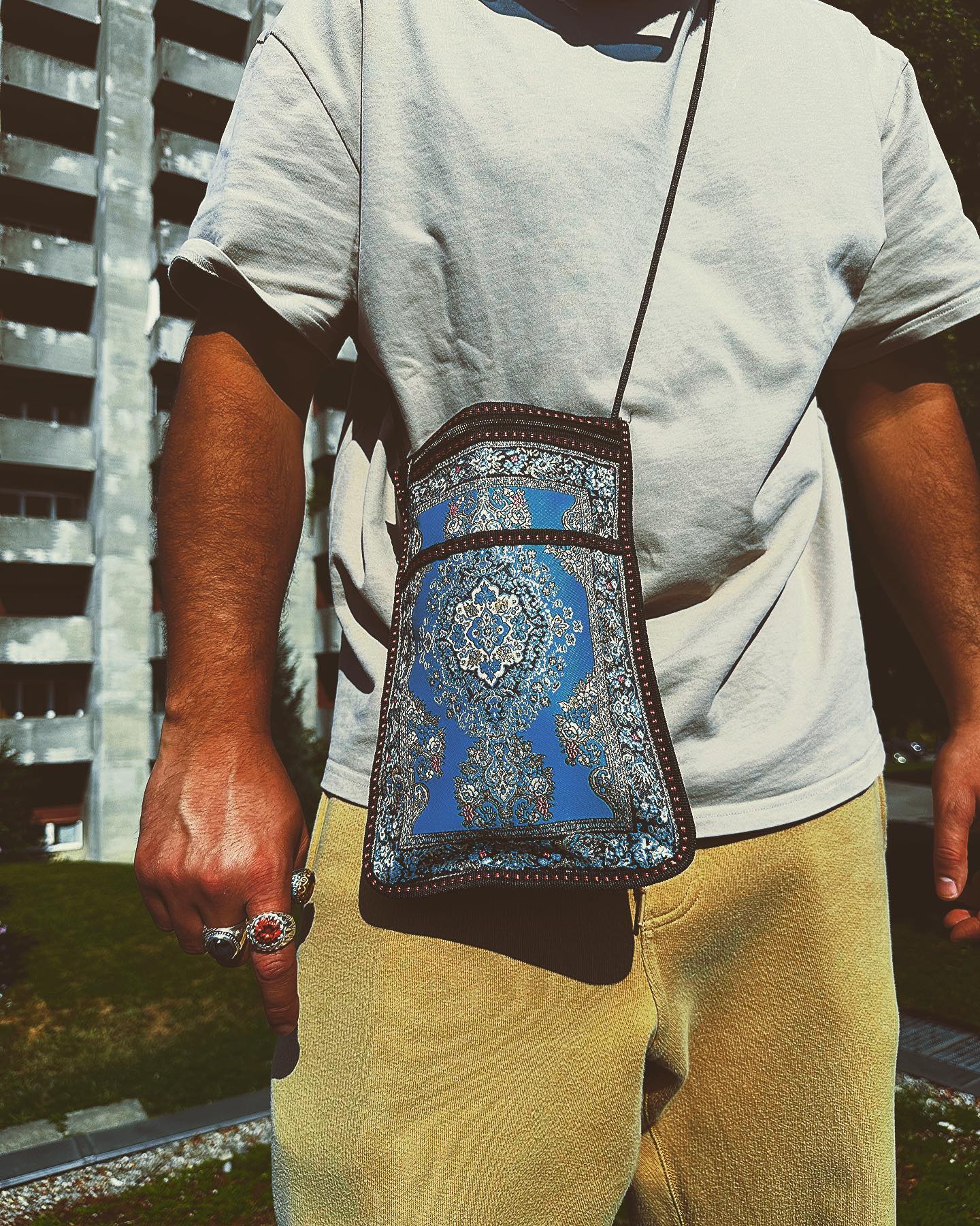 Walnut desk organizer set with white modular trays, next to porcelain mug on wooden desk.