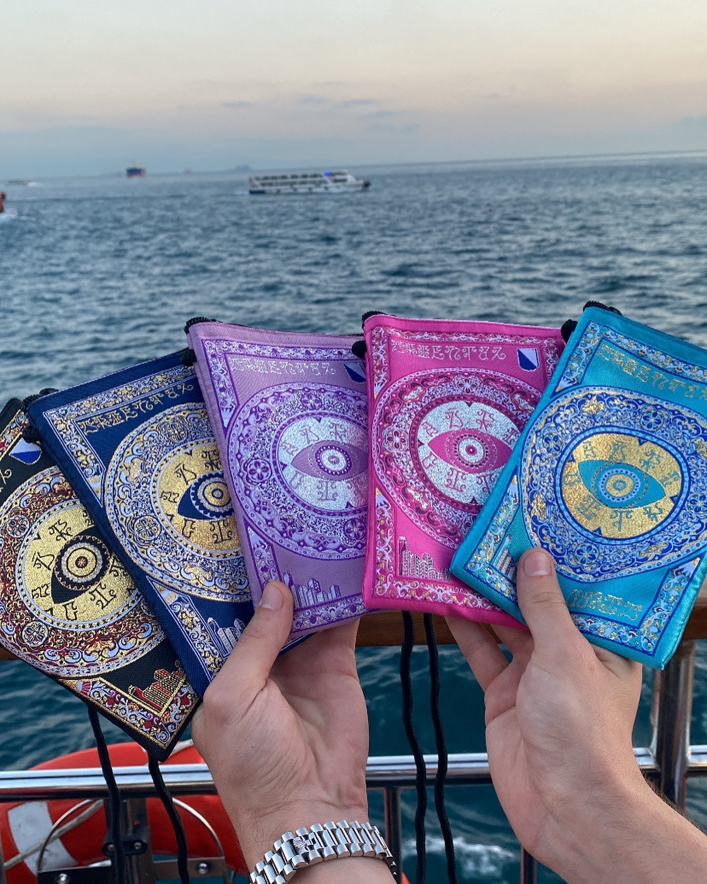 Two models wearing women's black cotton crewneck tee and off-white cotton crewneck tee.